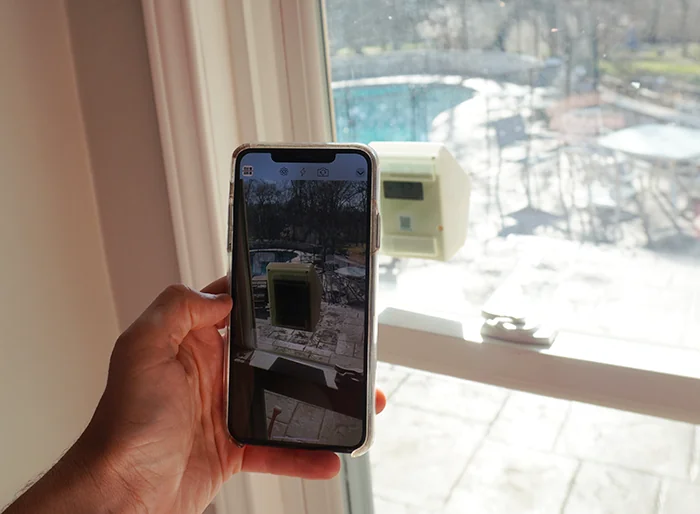 Person scanning the Airnote QR code with a phone